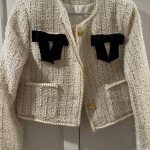Chic Cream Tweed Jacket with Black Accents